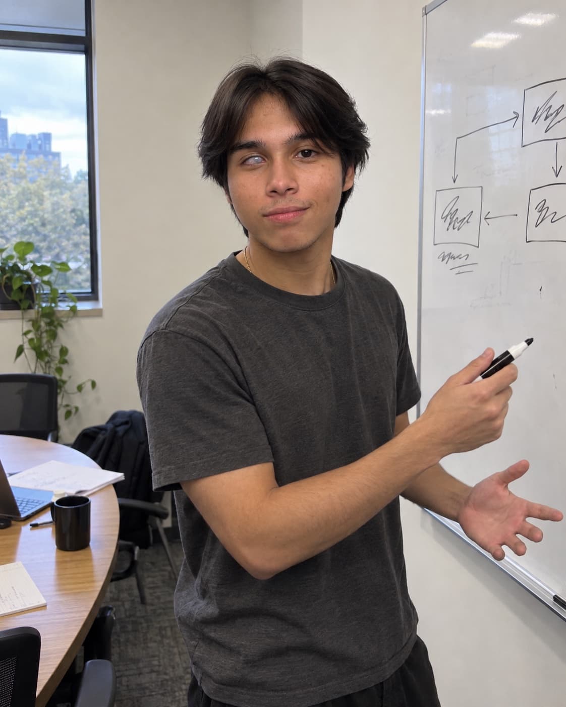 Victor Lee Frémont at a whiteboard, walking through a system diagram